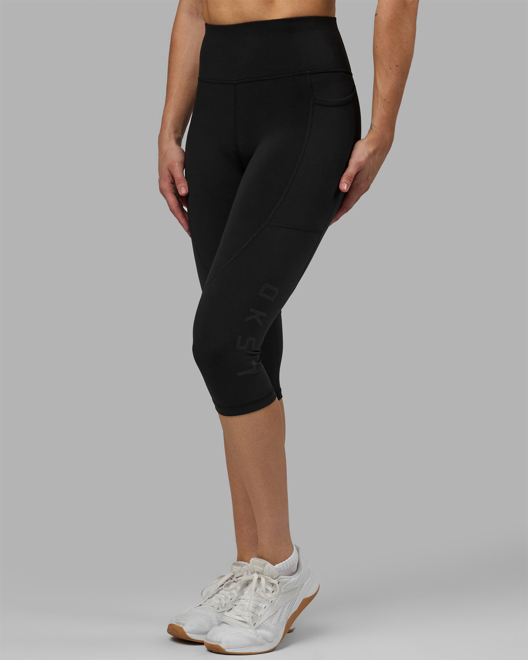 Woman wearing Rep Ultra High-Rise 3/4 Legging Pockets - Black-Black | Model:Hannah | Size:S