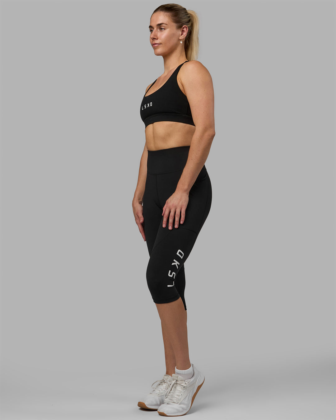 Woman wearing Rep Ultra High-Rise 3/4 Legging Pockets - Black-White | Model:Hannah | Size:S
