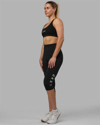 Woman wearing Rep Ultra High-Rise 3/4 Legging Pockets - Black-White | Model:Hannah | Size:S