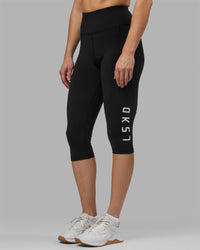 Woman wearing Rep Ultra High-Rise 3/4 Legging Pockets - Black-White | Model:Hannah | Size:S