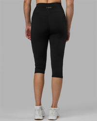 Woman wearing Rep Ultra High-Rise 3/4 Legging Pockets - Black-White | Model:Hannah | Size:S