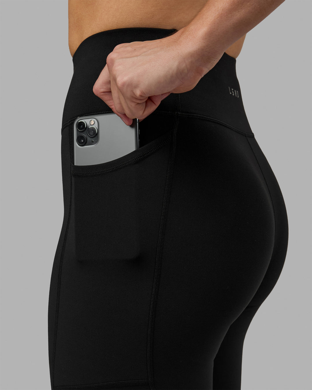 Woman wearing Rep Ultra High-Rise 3/4 Legging Pockets - Black-White | Model:Hannah | Size:S