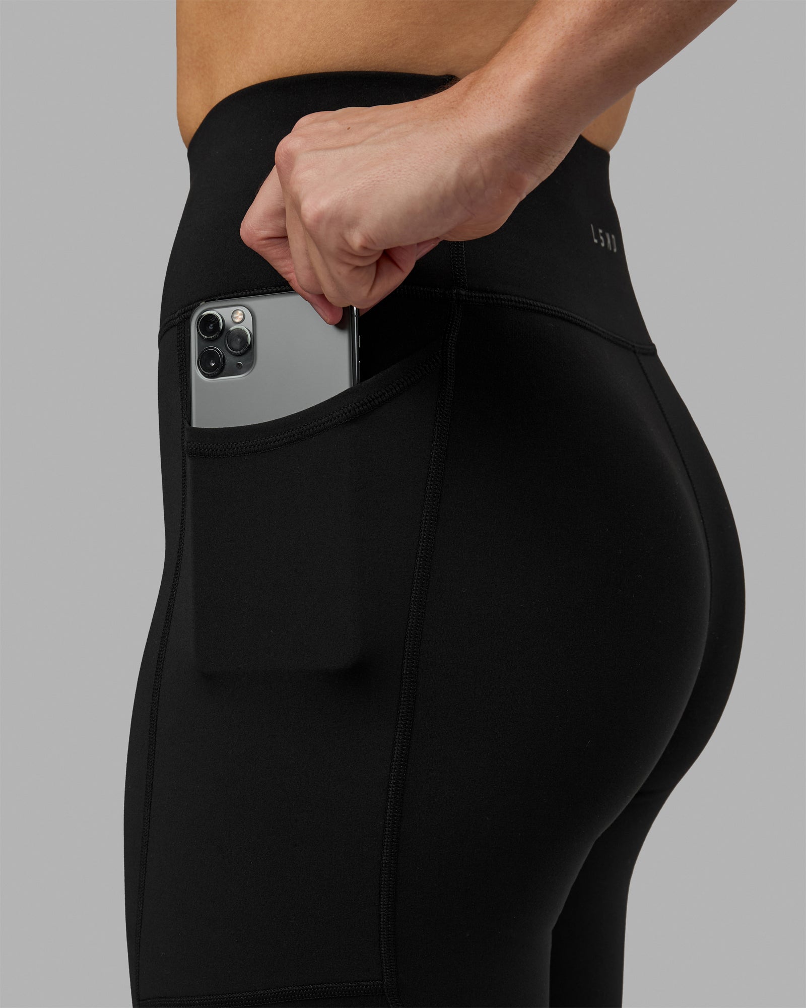 Woman wearing Rep Ultra High-Rise 3/4 Legging Pockets - Black-White | Model:Hannah | Size:S