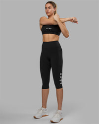 Woman wearing Rep Ultra High-Rise 3/4 Legging Pockets - Black-White | Model:Hannah | Size:S