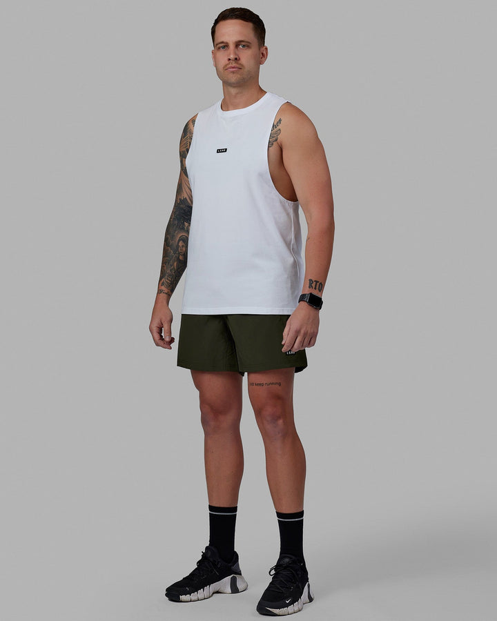Man wearing Rep 5'' Performance Short - Forest Night-Lime