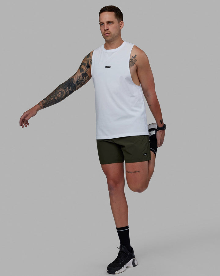 Man wearing Rep 5'' Performance Short - Forest Night-Lime