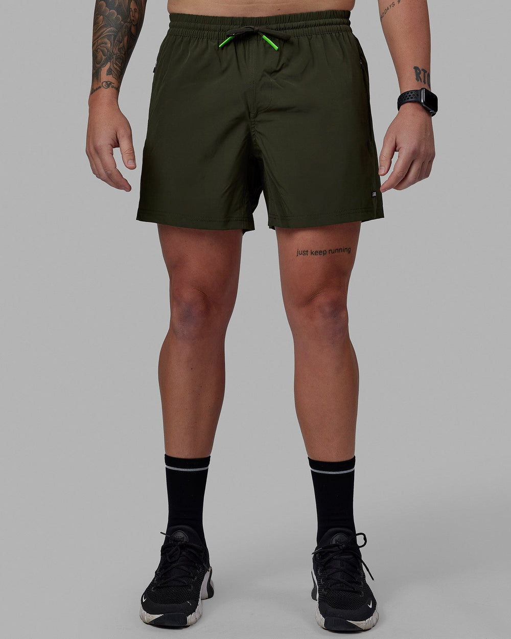 Man wearing Rep 5'' Performance Short - Forest Night-Lime