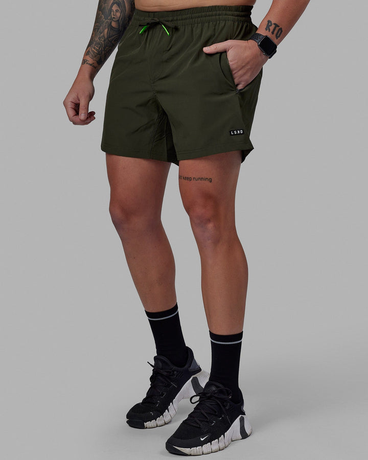 Man wearing Rep 5'' Performance Short - Forest Night-Lime