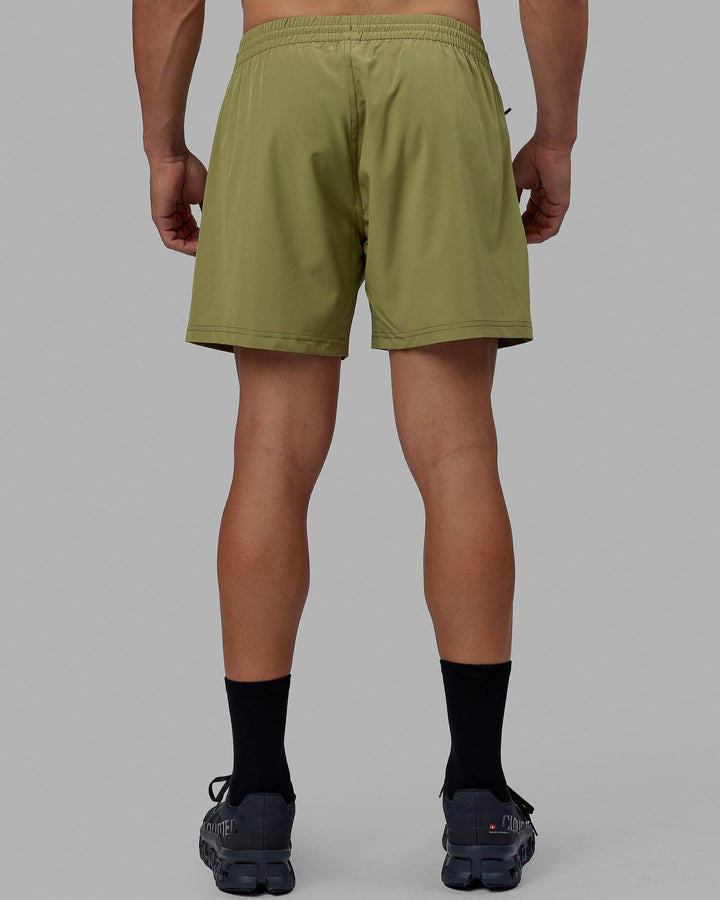 Man wearing Rep 5'' Performance Short - Moss Stone-Lime