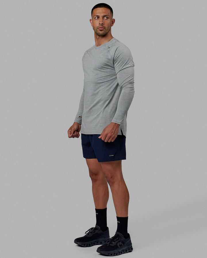 Man wearing Rep 5" Performance Short - Navy