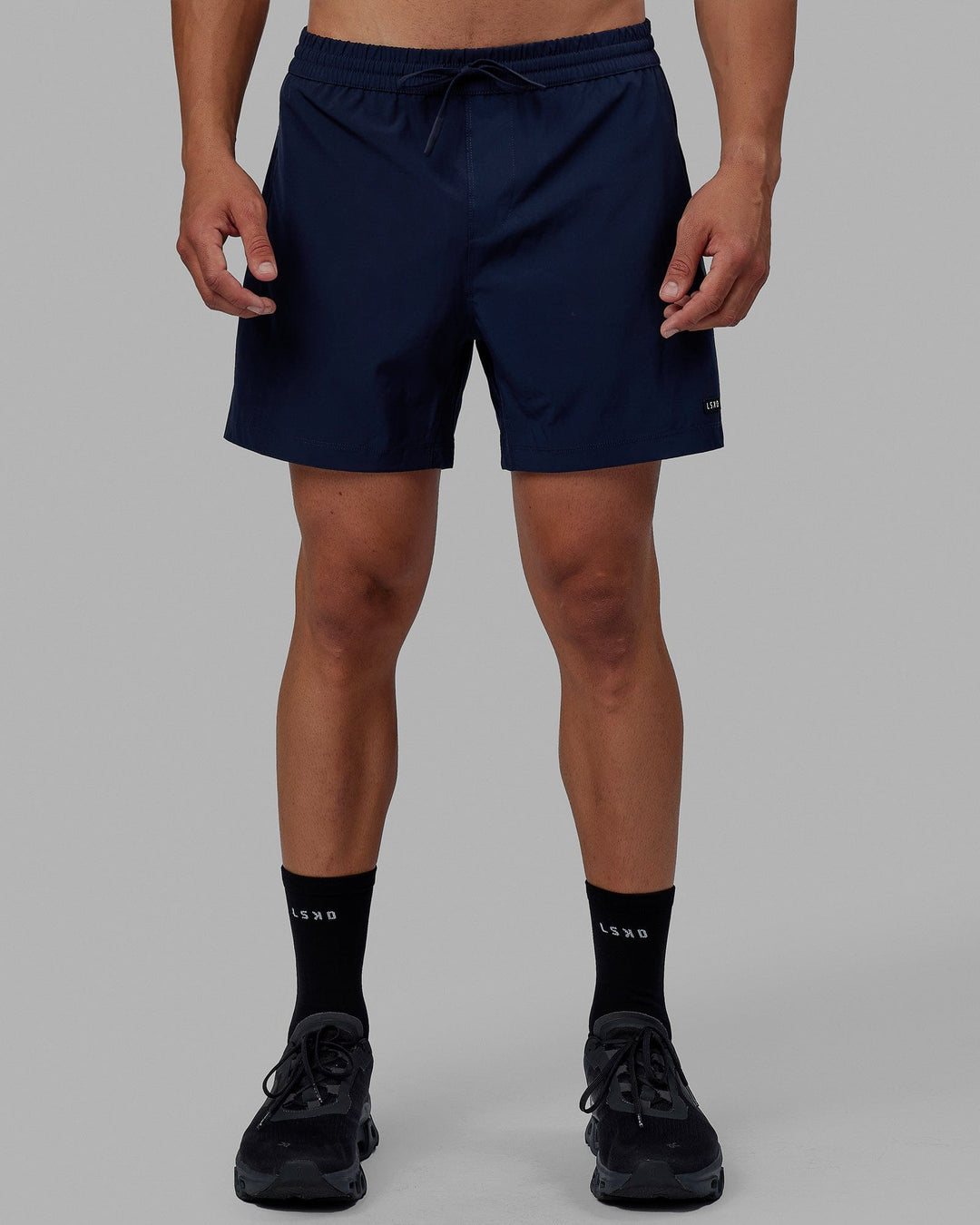 Man wearing Rep 5" Performance Short - Navy