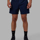 Man wearing Rep 5" Performance Short - Navy