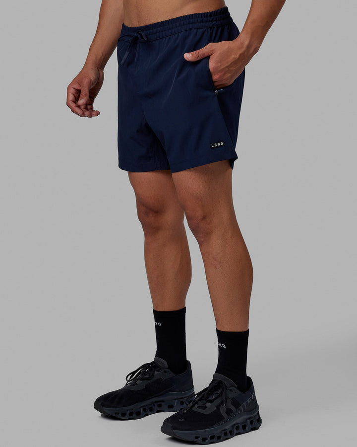 Man wearing Rep 5" Performance Short - Navy