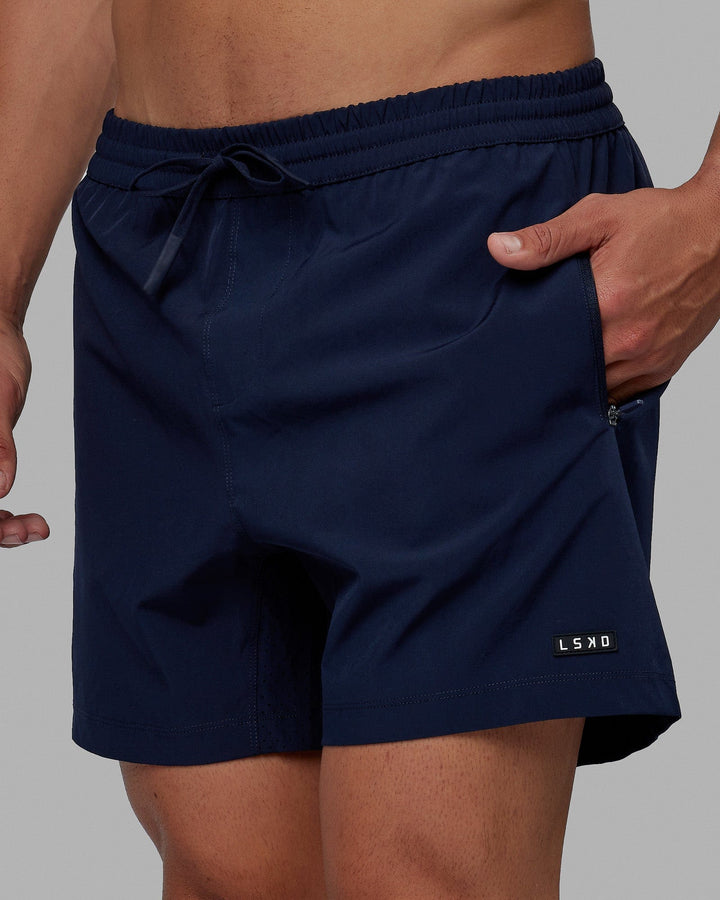 Man wearing Rep 5" Performance Short - Navy