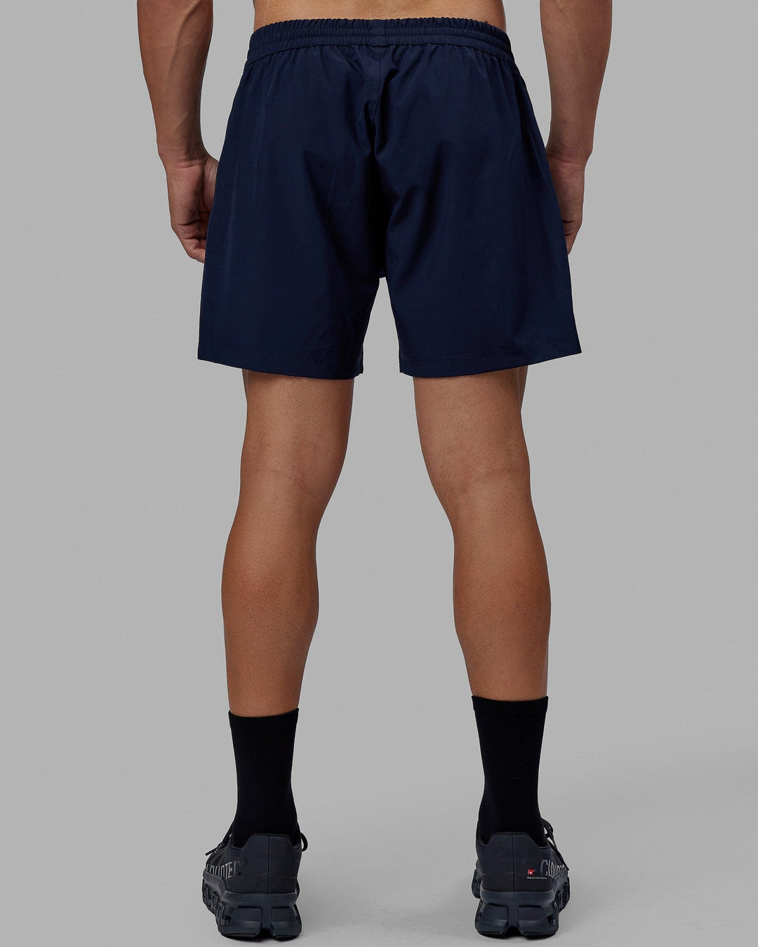 Man wearing Rep 5" Performance Short - Navy