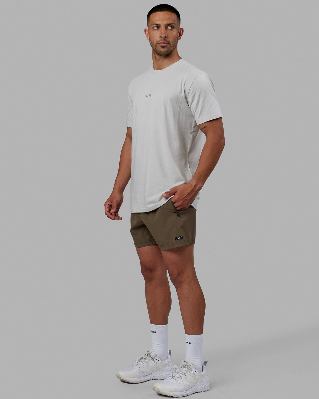 Man wearing Rep 5'' Performance Short - Olive Leaf