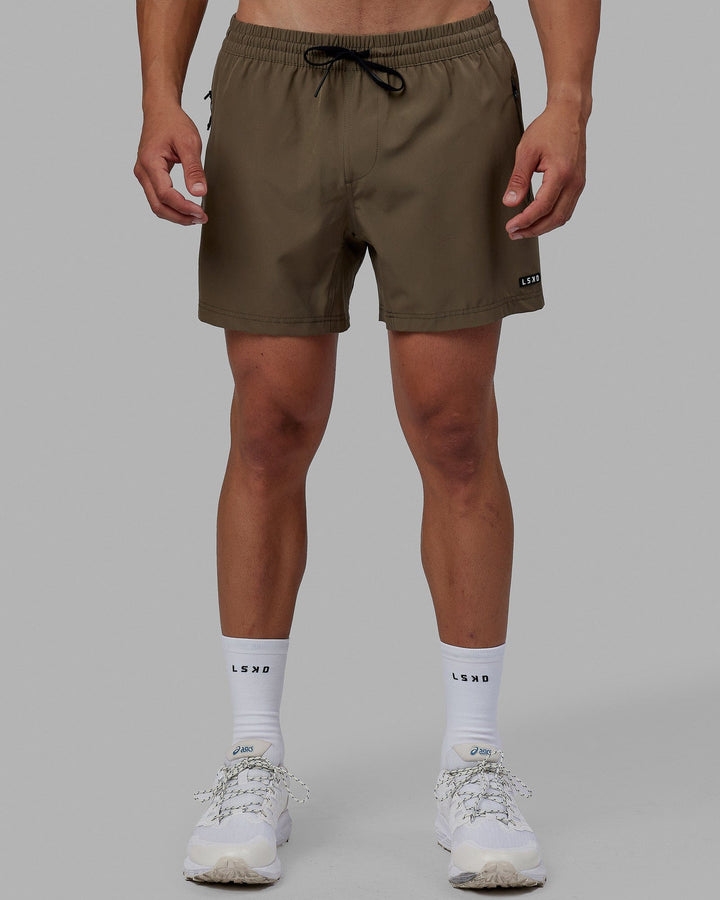 Man wearing Rep 5'' Performance Short - Olive Leaf