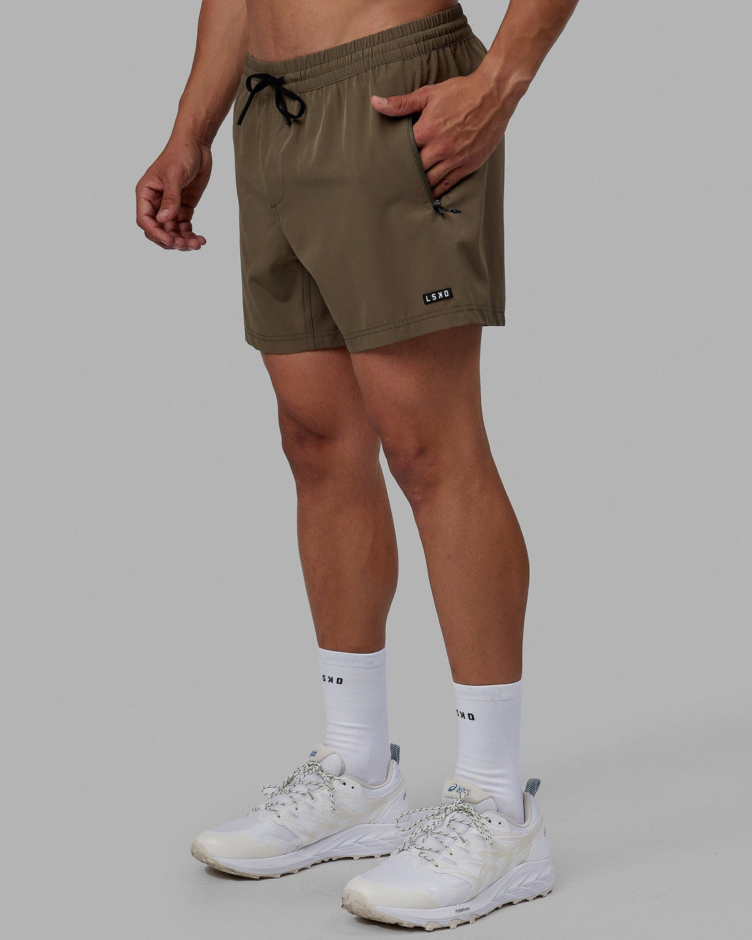 Man wearing Rep 5'' Performance Short - Olive Leaf