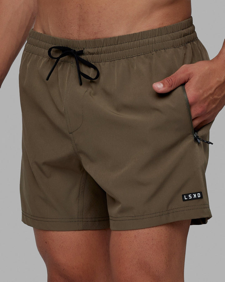 Man wearing Rep 5'' Performance Short - Olive Leaf