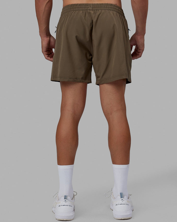 Man wearing Rep 5'' Performance Short - Olive Leaf