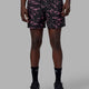 Man wearing Rep 5" Performance Short - Terrain Black-Pink Rose