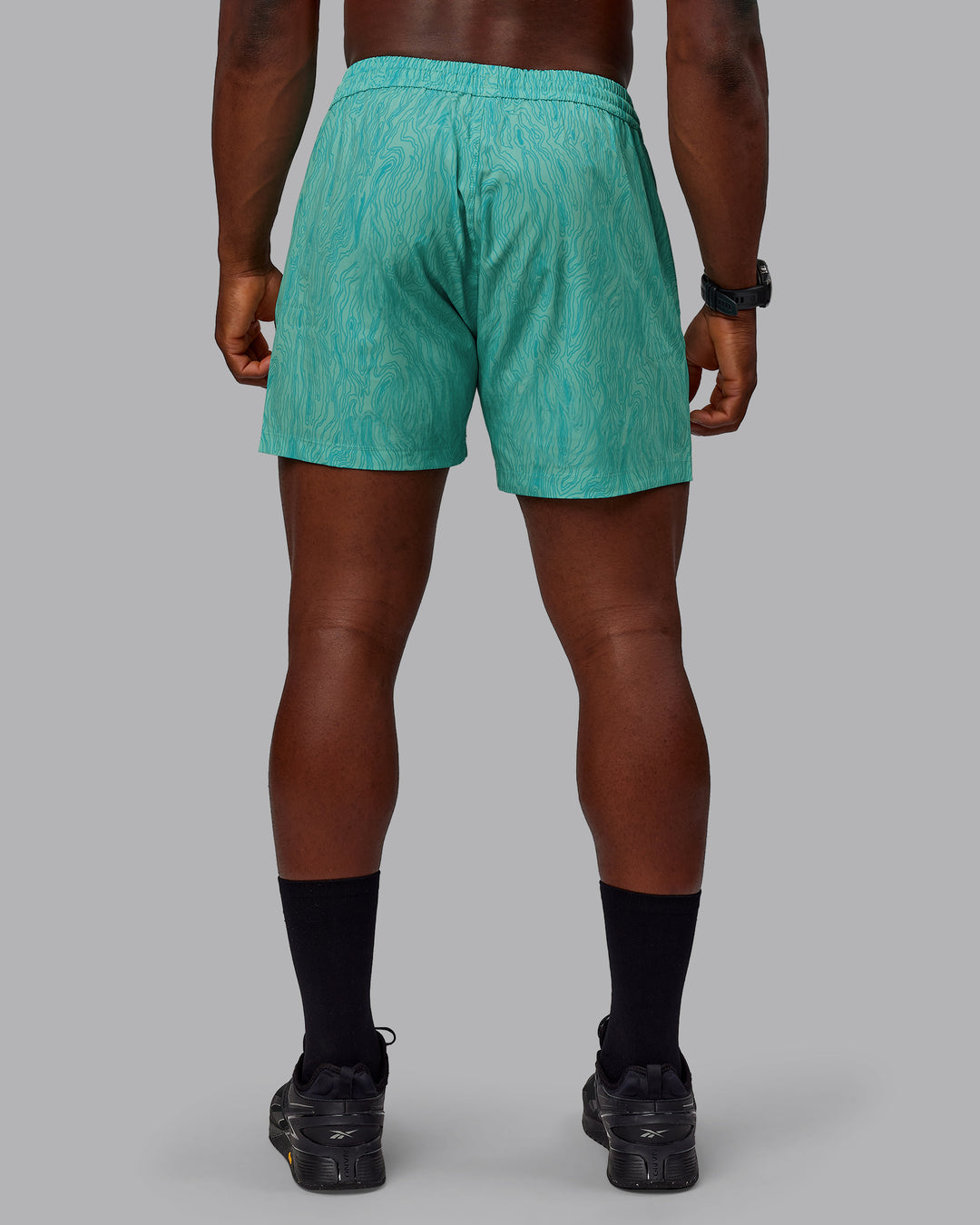 Man wearing Rep 5" Performance Shorts - Topographic Blue Bird