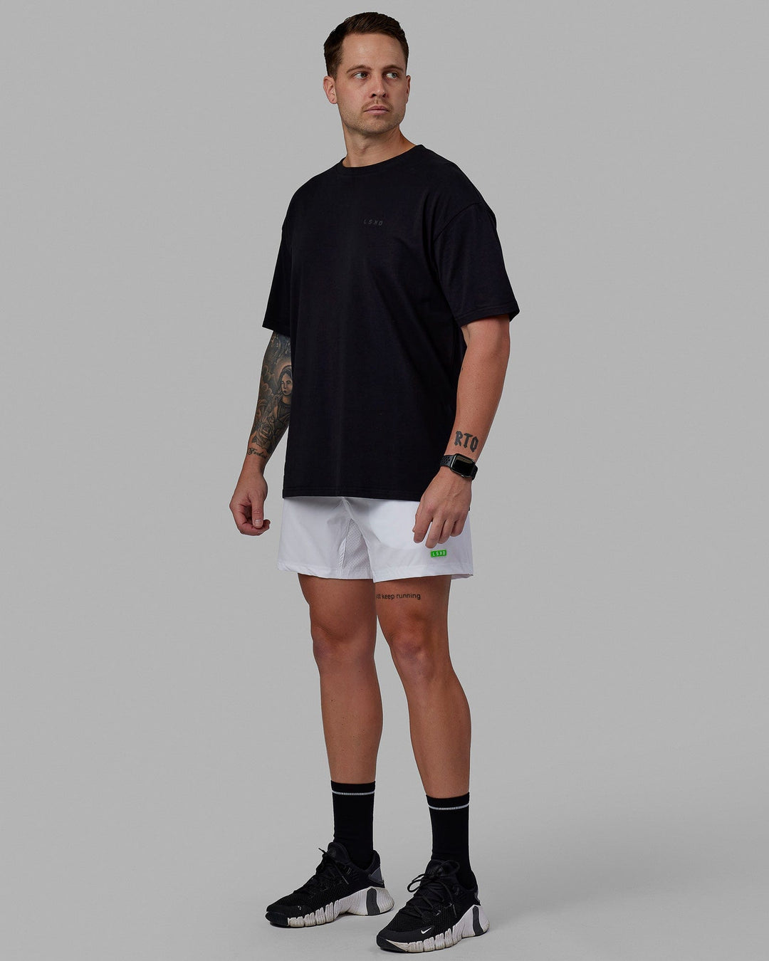 Man wearing Rep 5'' Performance Short - White-Lime