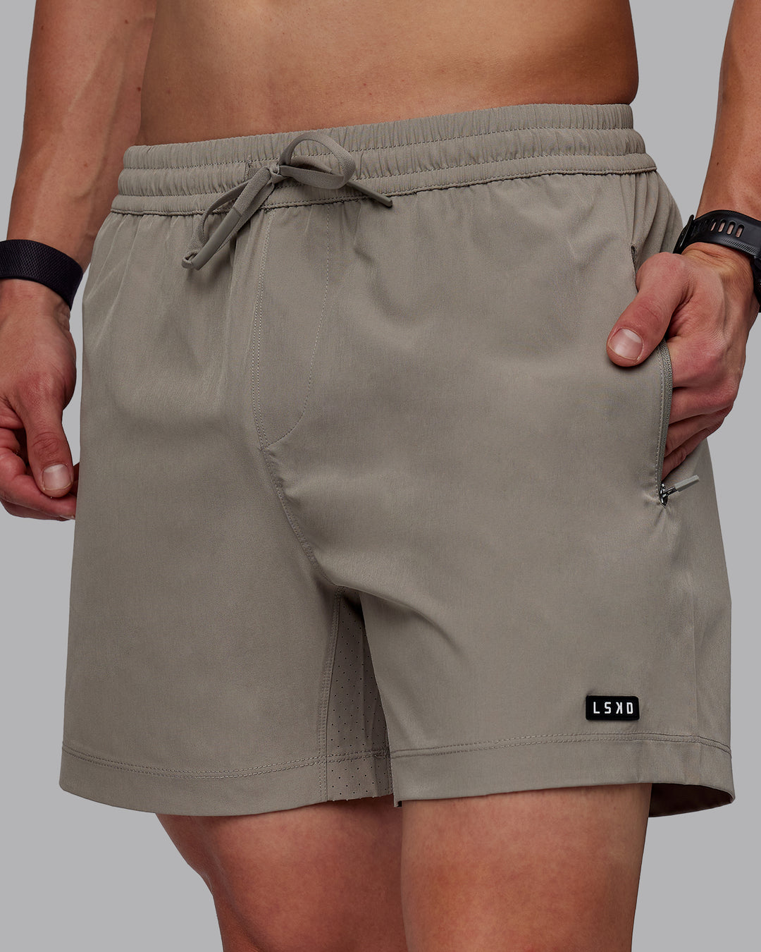 Man wearing Rep 5" Performance Shorts - Elephant