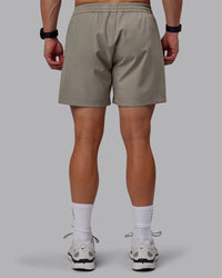 Man wearing Rep 5" Performance Shorts - Elephant