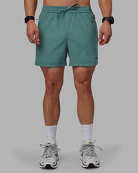 Man wearing Rep 5" Performance Shorts - Sage Bush
