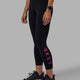 Woman wearing Rep 7/8 Length Tights - Black-Ultra Pink