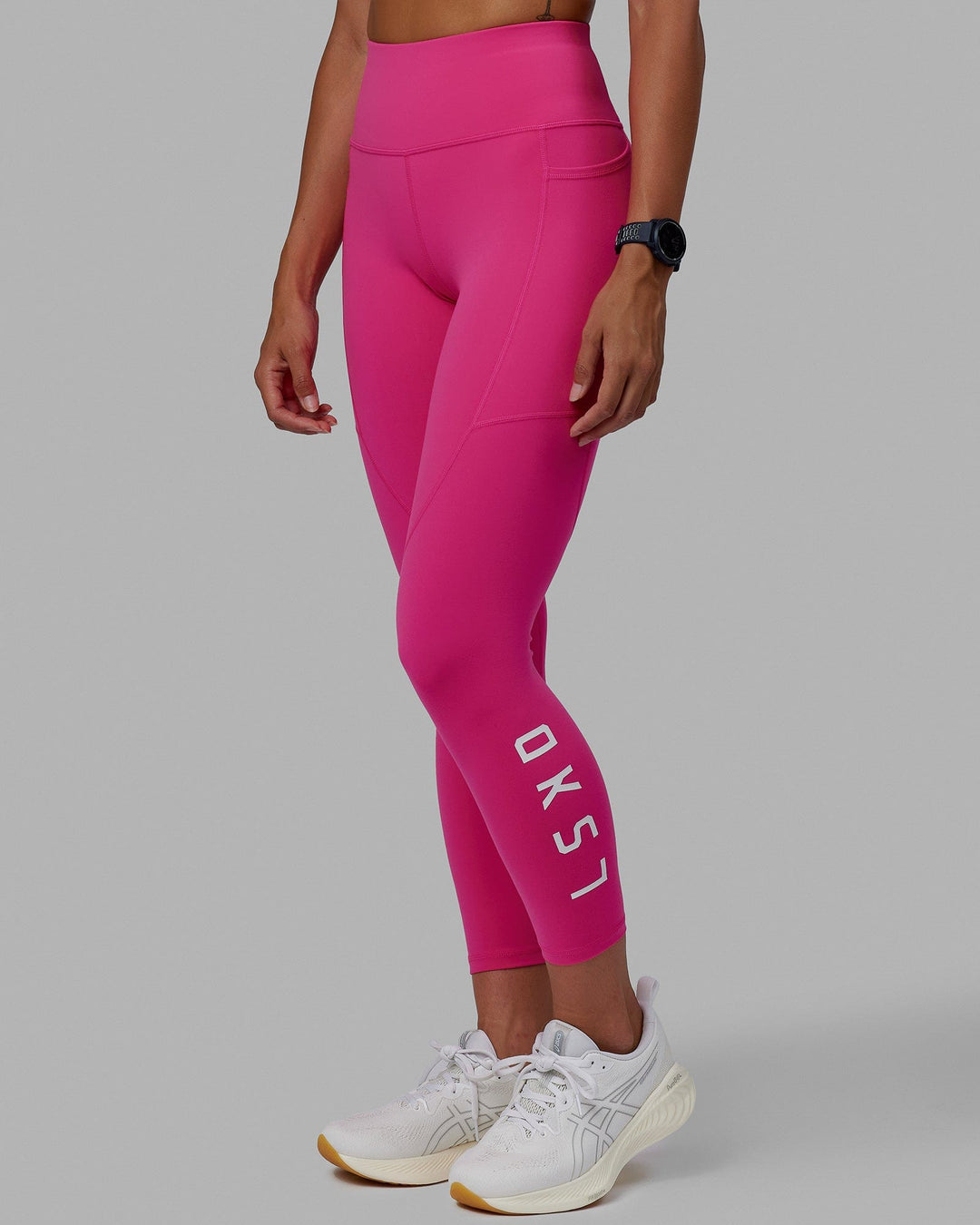 Woman wearing Rep Ultra High-Rise 7/8 Legging Pockets - Ultra Pink-White | Model:Vanessa | Size:S