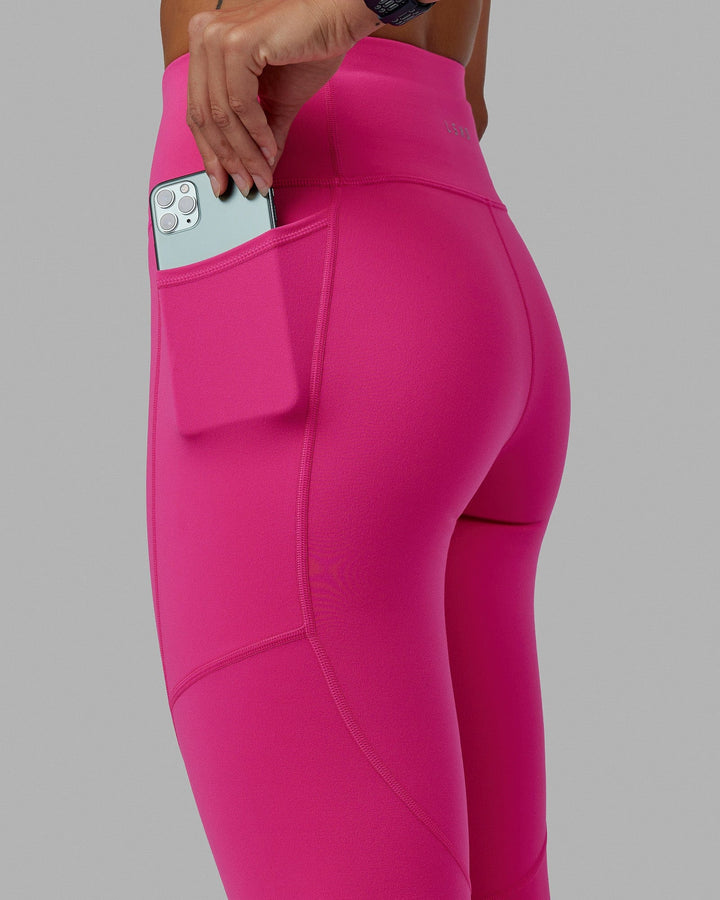 Woman wearing Rep 7/8 Length Tights - Ultra Pink-White