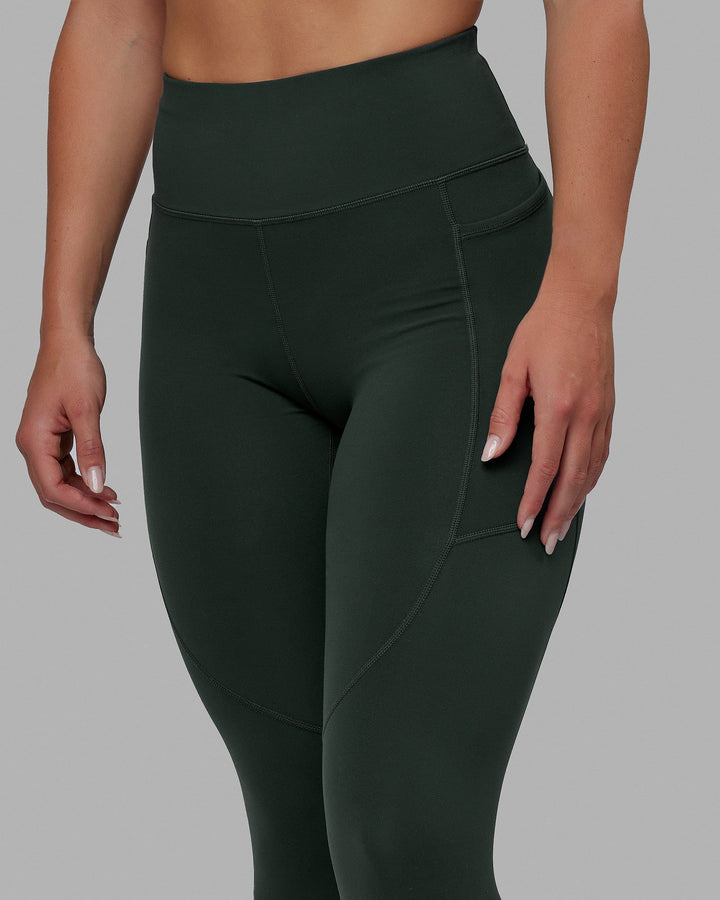 Woman wearing Rep 7/8 Length Tights - Vital Green