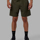 Man wearing Rep 7'' Performance Short - Forest Night