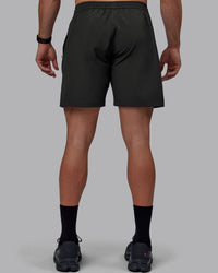 Man wearing Rep 7" Performance Shorts - Pirate Black