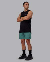 Man wearing Rep 7" Performance Shorts - Sage Bush