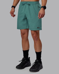 Man wearing Rep 7" Performance Shorts - Sage Bush