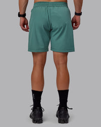 Man wearing Rep 7" Performance Shorts - Sage Bush