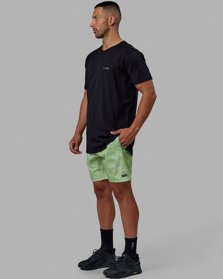 Man wearing Rep 7'' Performance Short - Terrain Green Fig