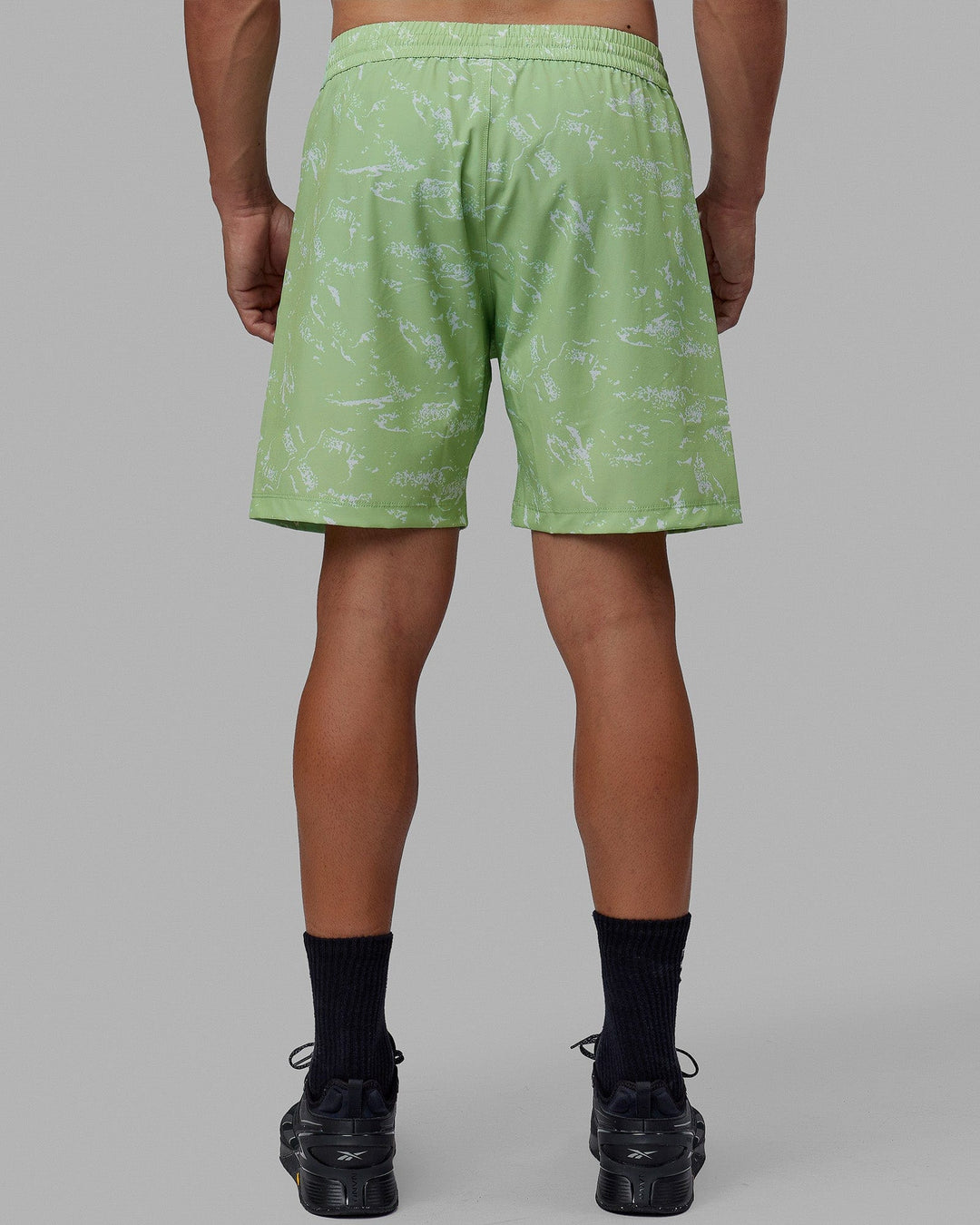 Man wearing Rep 7'' Performance Short - Terrain Green Fig