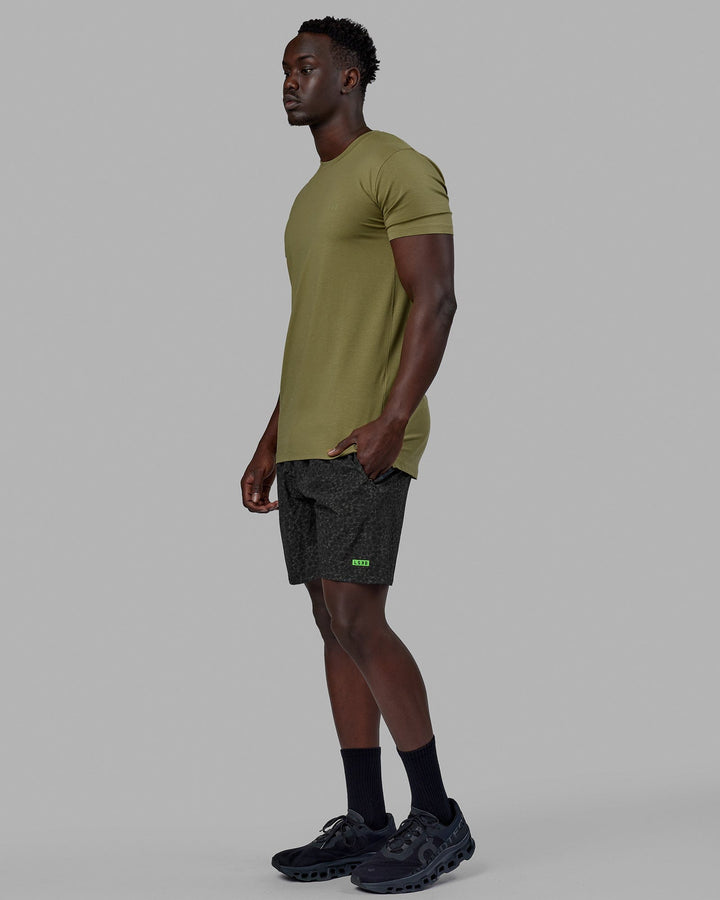 Woman wearing Rep 7'' Performance Short - Jungle Spot Print
