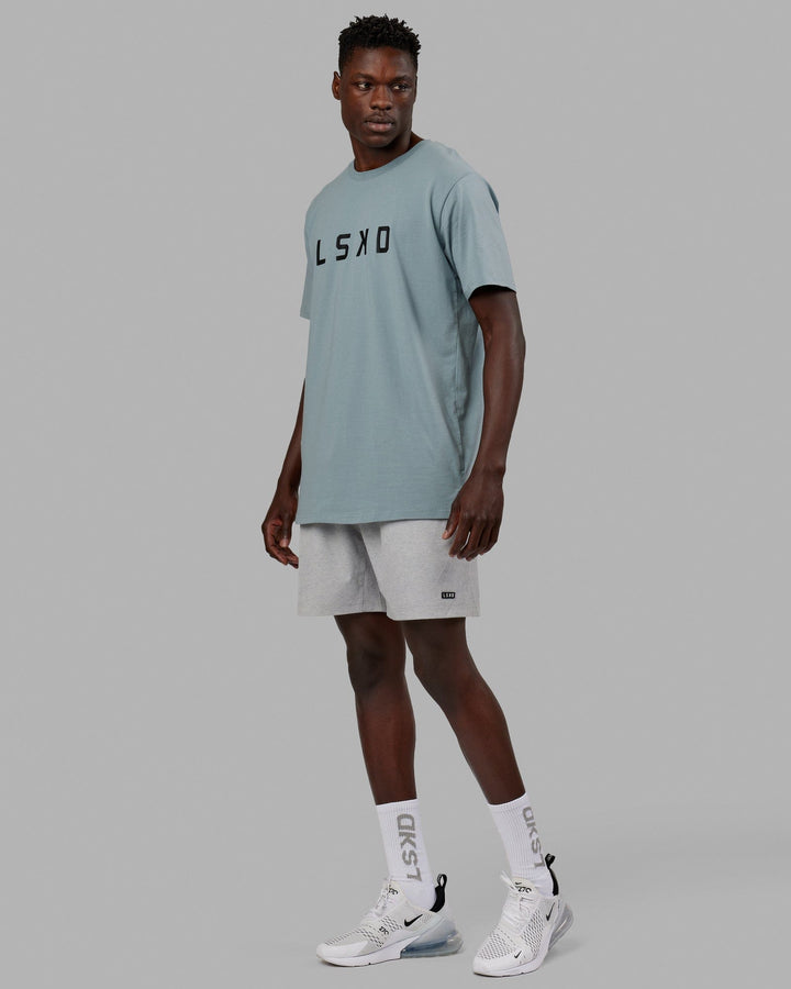Man wearing Rep 7" Performance Short - Light Grey Marl