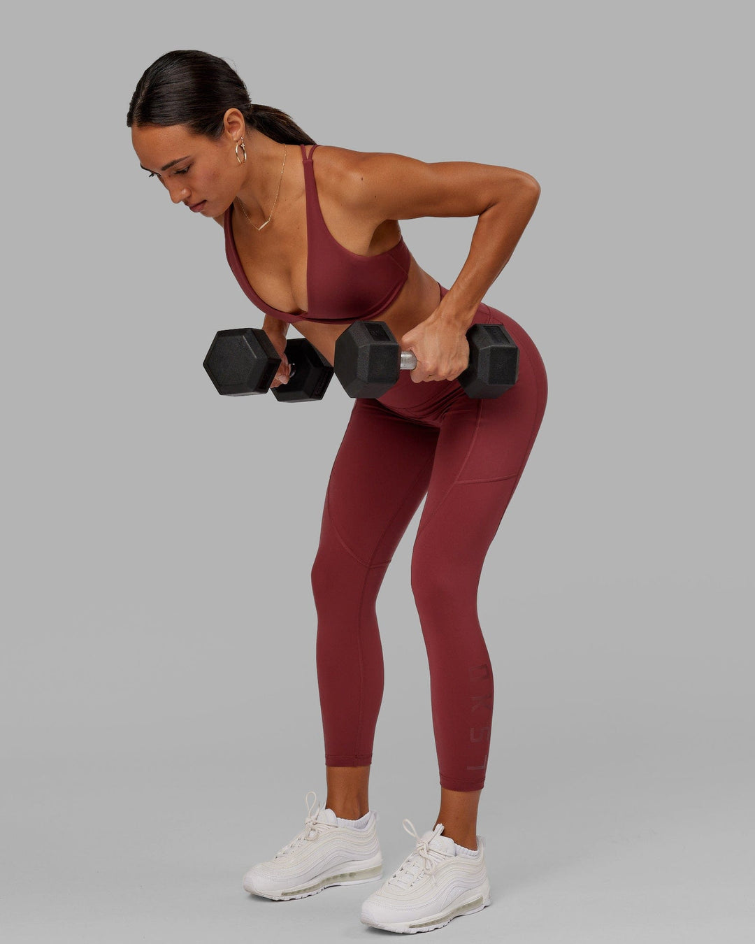 Woman wearing Rep 7/8 Length Tight - Apple Berry