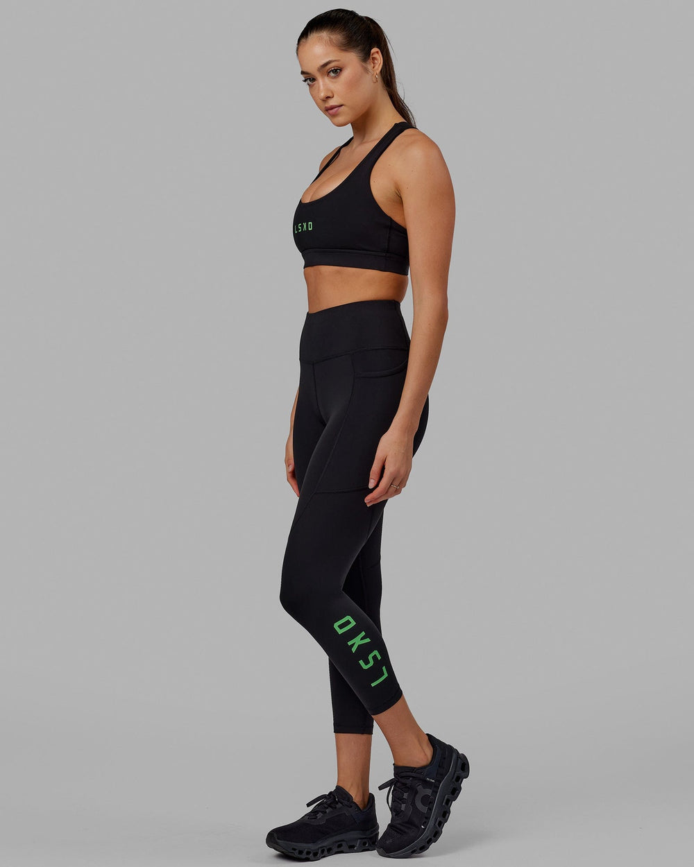 Woman wearing Rep 7/8 Length Tight - Black-Apple Mint
