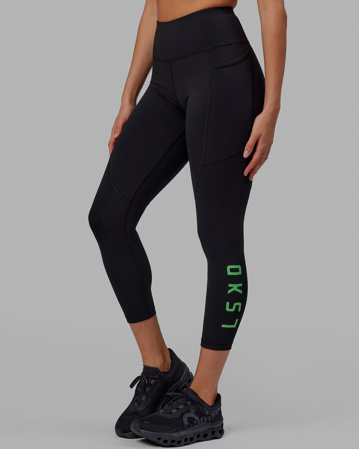 Woman wearing Rep 7/8 Length Tight - Black-Apple Mint