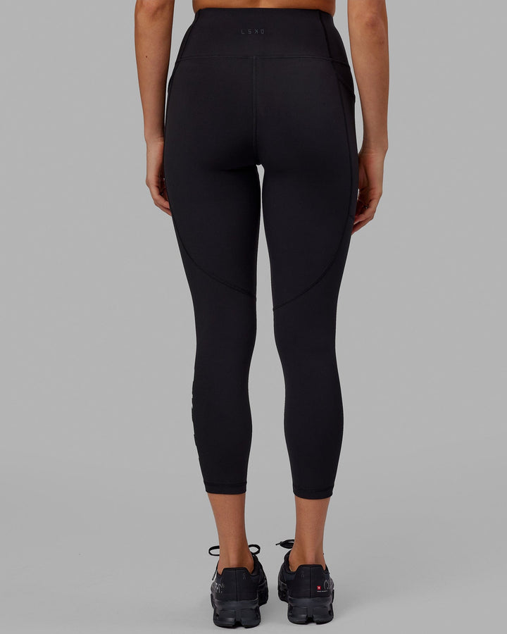 Woman wearing Rep 7/8 Length Tight - Black-Apple Mint