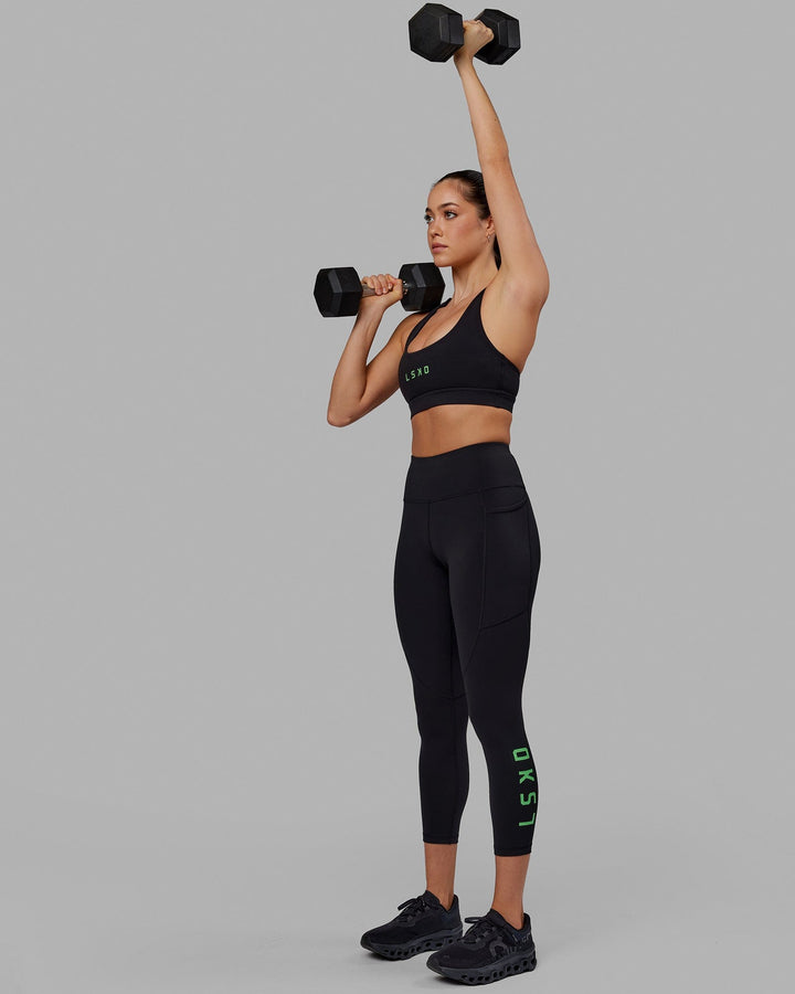 Woman wearing Rep 7/8 Length Tight - Black-Apple Mint