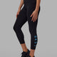 Woman wearing Rep 7/8 Length Tight - Black-Azure Blue
