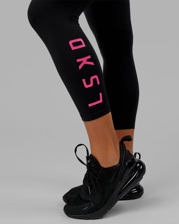 Woman wearing Rep 7/8 Length Tight - Black-Boysenberry